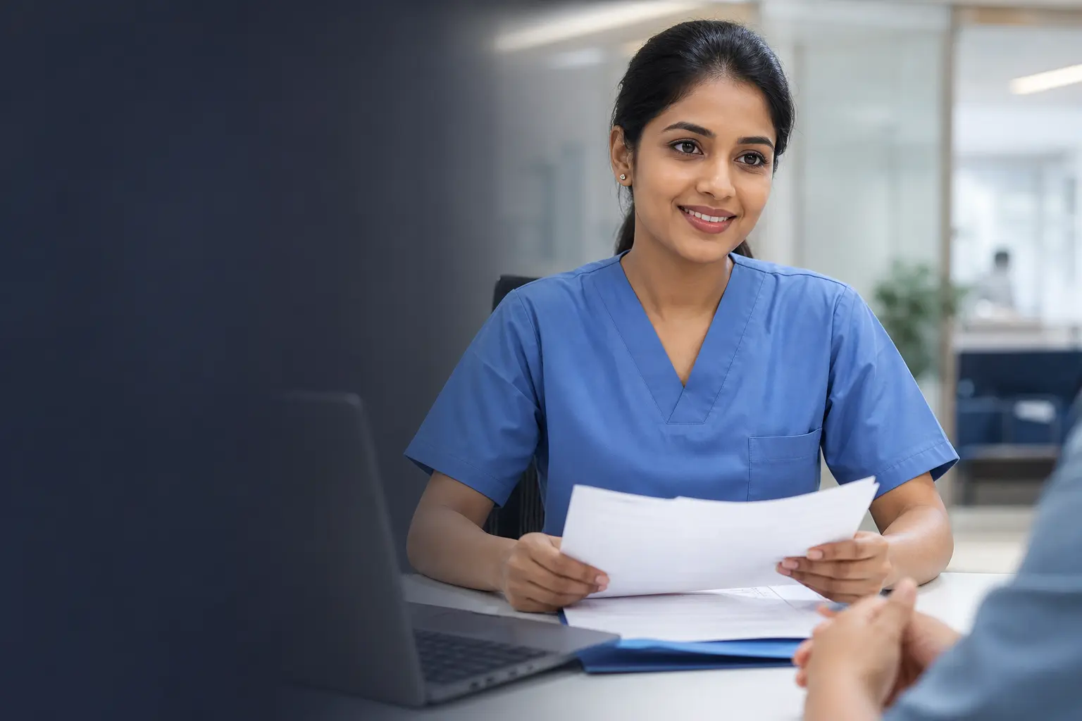Indian nurse receiving guidance with professional documents